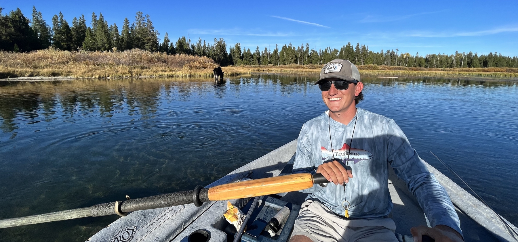 Blakely Epperson, TroutHunter guide, rows a drift boat