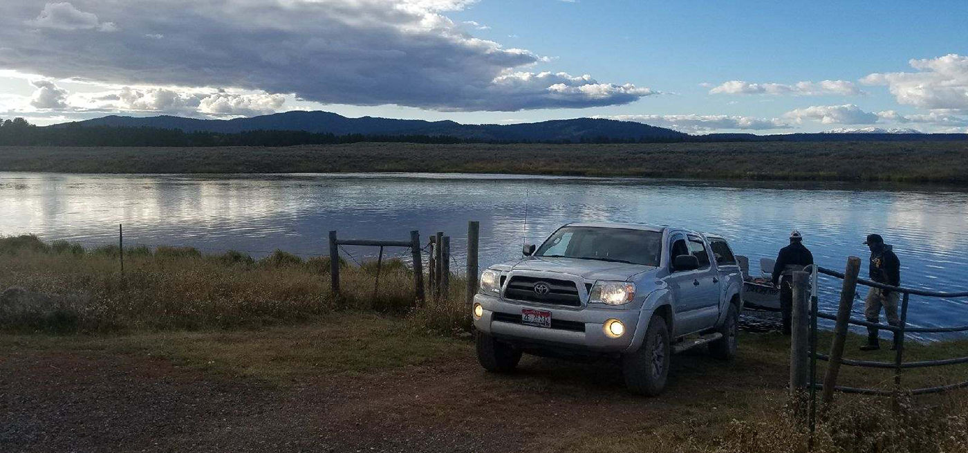 Fly fishing guide takes their drift boat out at Wood Rd 16